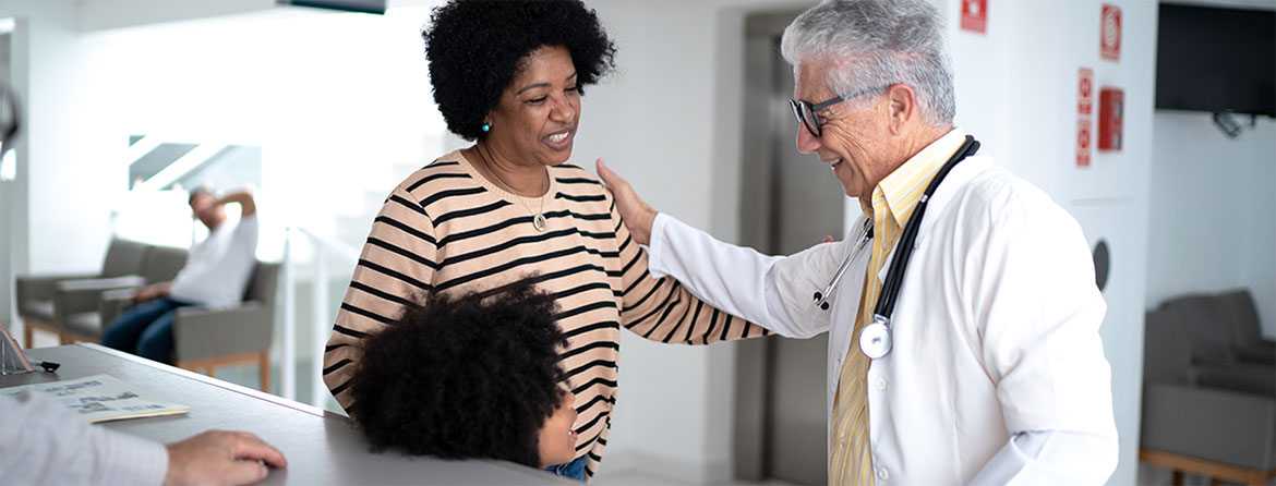 A woman speaking with a doctor